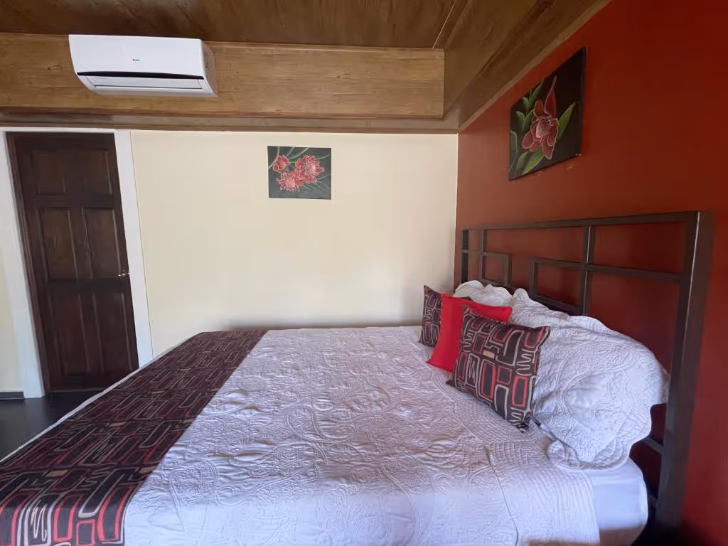 Deluxe Familiar Room with three queen beds at Hotel Campos Arenal