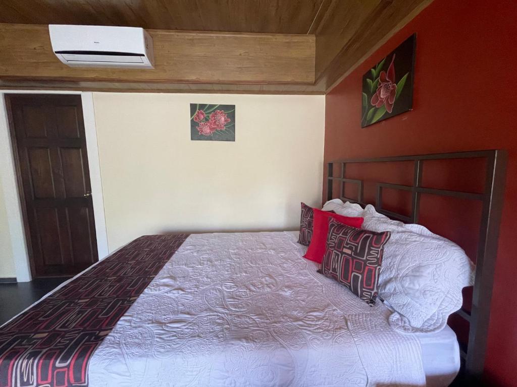 Deluxe Familiar Room with three queen beds at Hotel Campos Arenal