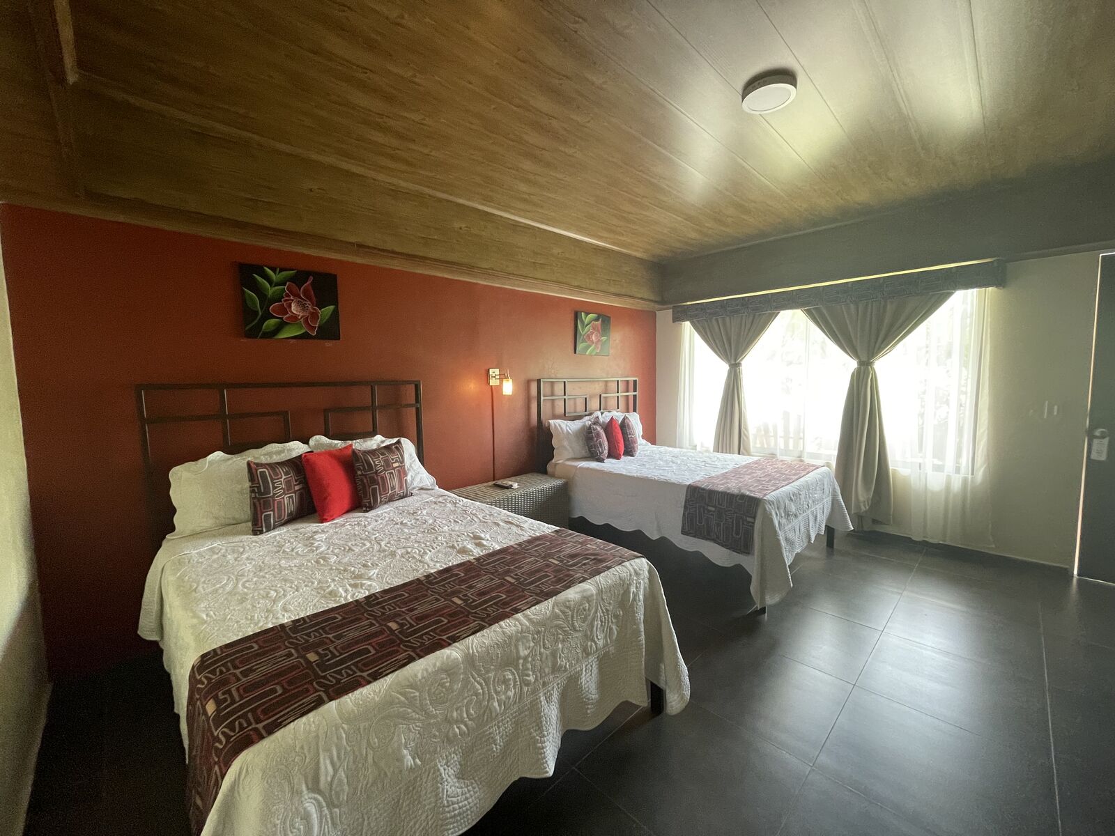 Deluxe Queen Room with two queen-size beds at Hotel Campos Arenal